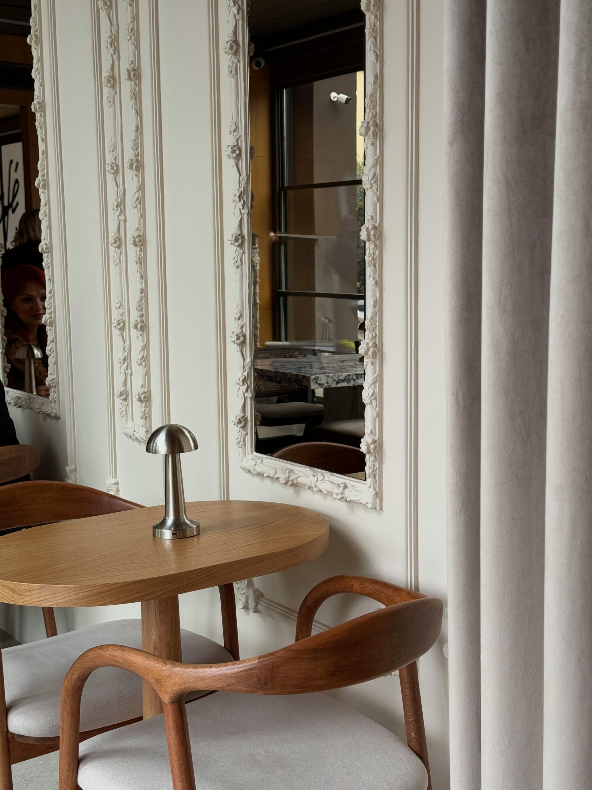 feminine interior with wooden chars and white walls