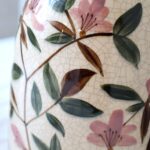 Close-up of JULIE Floral Vase from Vintelio, featuring hand-painted pink flowers and green leaves on a cream crackle-glazed ceramic surface