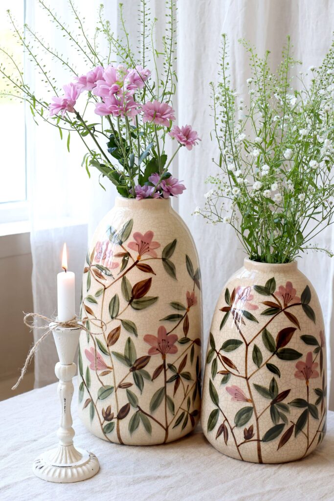 Pair of JULIE Floral Vases by Vintelio, hand-painted with pink flowers and green foliage, styled with fresh flowers on a light table setting